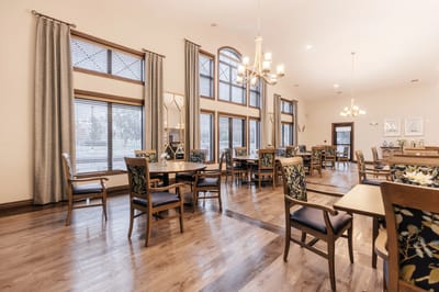 Interior dining area with wooden tables and bright lighting