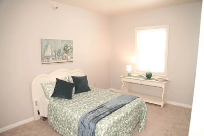A cozy resident room with a bed and decor