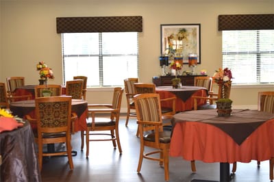 Dining area with tables and floral decorations
