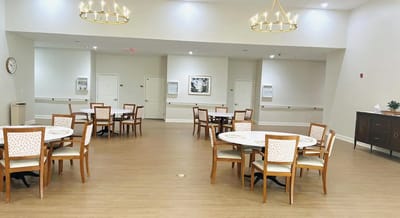 Bright dining room with tables and chairs