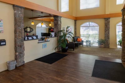Bright lobby area with stone accents and seating