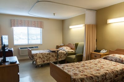 Interior view of a resident room with two beds