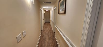 Long hallway with lighting and decorative art