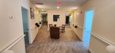 Interior hallway with seating area in a senior care facility