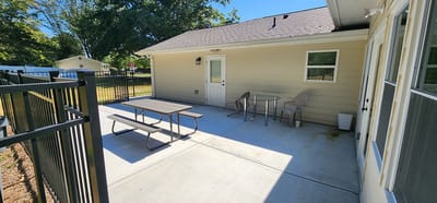 Outdoor patio with tables and chairs
