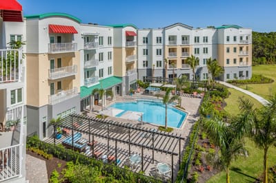 Aerial view of a senior living facility with a pool