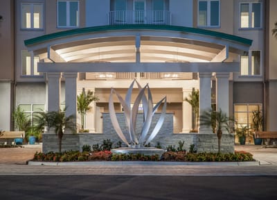 Exterior view of the facility entrance with landscaped area