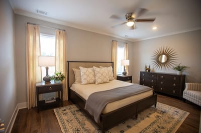 Bright and inviting resident bedroom with comfortable furnishings