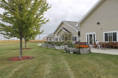 Outdoor space with gardens and facility building