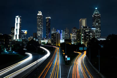 City skyline at night with illuminated buildings