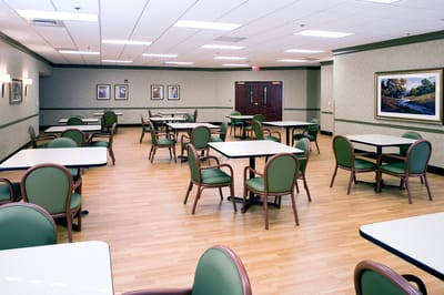 Bright, spacious dining area with tables and chairs