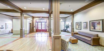 Bright common area with seating and natural lighting