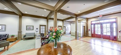 Bright and inviting common area with floral arrangement