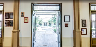 Entrance view to a courtyard from inside the facility