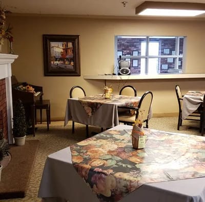 Cozy dining area with tables and chairs arranged