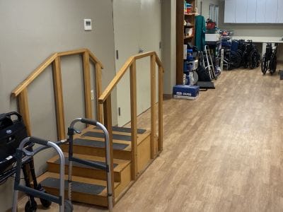 Interior hallway with mobility aids and a staircase