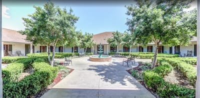 Outdoor courtyard with fountain and seating areas