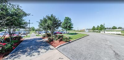 Pathway and landscaped area outside the facility
