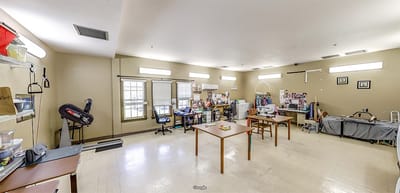 Bright activity room with tables and art supplies