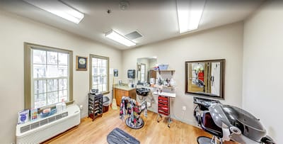 Interior view of a hair salon with styling stations