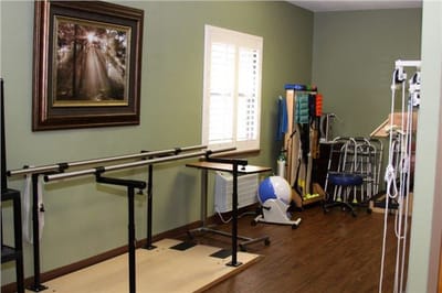 Therapy space with equipment and artwork on the wall