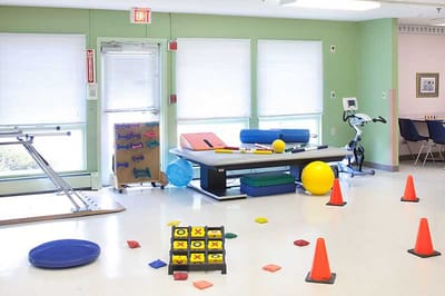 Interior activity space with exercise equipment and colorful props