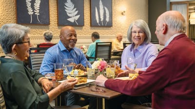 Residents enjoying a meal together in a dining area