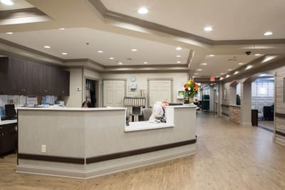 Reception area with staff at the front desk