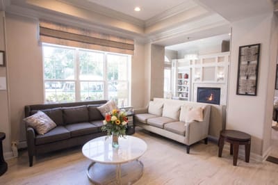 Cozy common area with seating and a bouquet of flowers