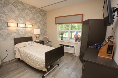 Cozy private resident room with a bed and decor.