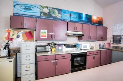 Interior of a kitchen area with appliances and cabinets