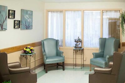 Cozy common area with chairs and floral decor