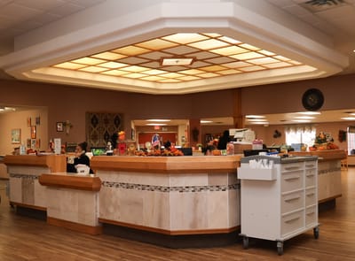 Interior view of a common area with residents and staff