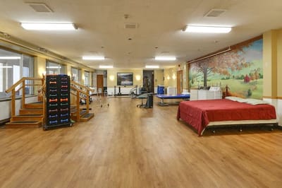 Interior view of a multi-use activity room with exercise equipment
