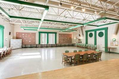 Spacious interior common area with tables and chairs