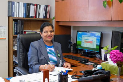 Staff member at their desk in an office environment
