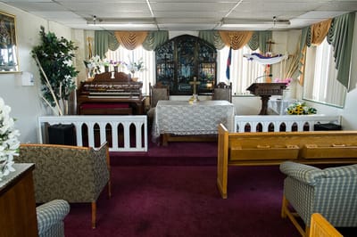 Interior view of a chapel with seating and decorations