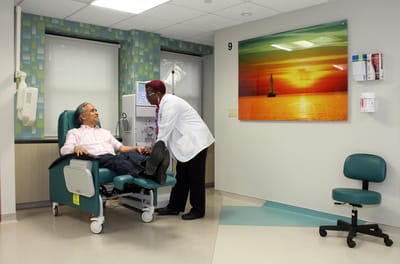 Patient receiving care in a well-lit treatment room