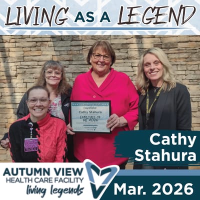 Employees holding an award at Autumn View Health Care Facility