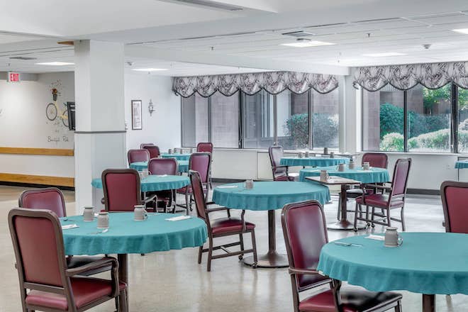 Bright dining room with turquoise tables and chairs