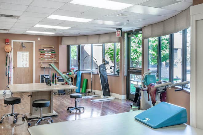 Therapy room with exercise equipment and natural light