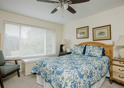 Cozy bedroom with floral bedding and natural light