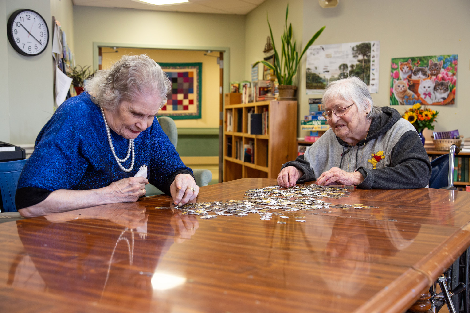 Two residents working on a jigsaw puzzle together
