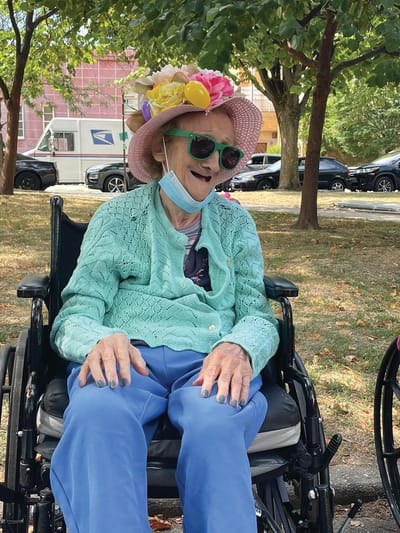 Resident enjoying the outdoors with colorful accessories