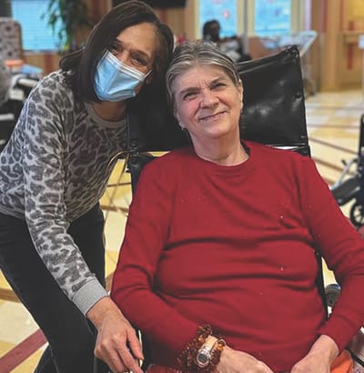 Staff member with resident in a welcoming interior space