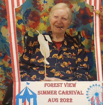 Resident enjoying a summer carnival activity
