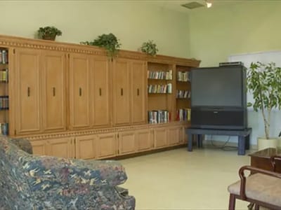 Common area with bookshelves and seating