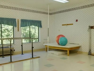 Interior view of a therapy room with exercise equipment