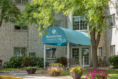 Exterior view of Benedictine Manor with entrance awning