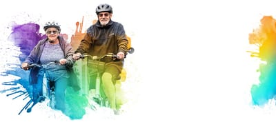 Elderly couple riding bicycles with colorful background